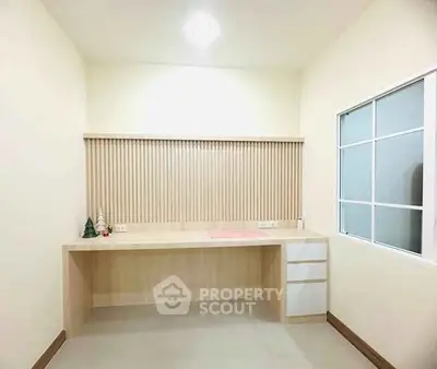 Minimalist study room with wooden desk and decorative accents