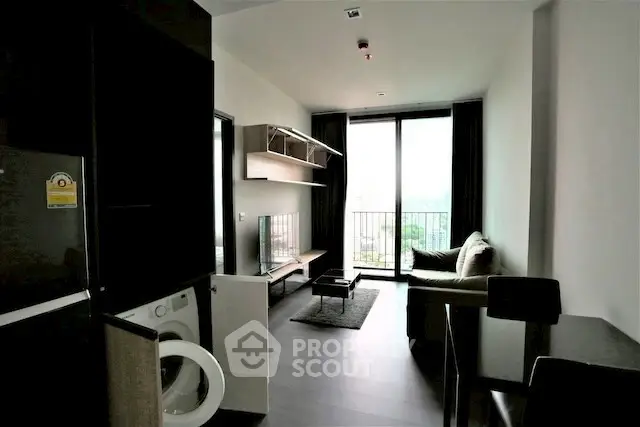 Modern living room with balcony view and sleek furniture in urban apartment.