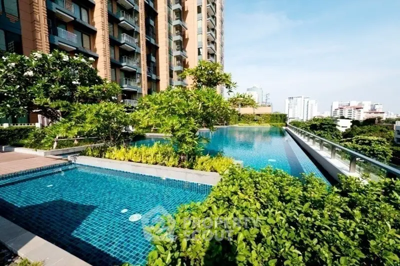 Luxurious rooftop pool with stunning city views and lush greenery