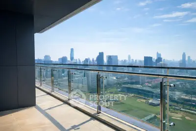 Stunning high-rise balcony with panoramic city skyline views, perfect for urban living enthusiasts.