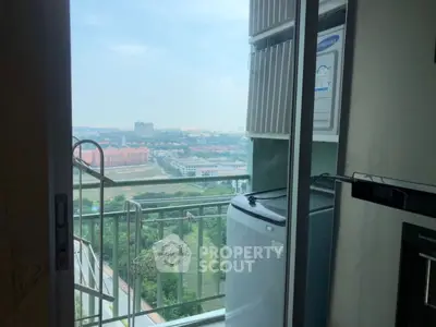 High-rise balcony with scenic city view and washing machine setup.