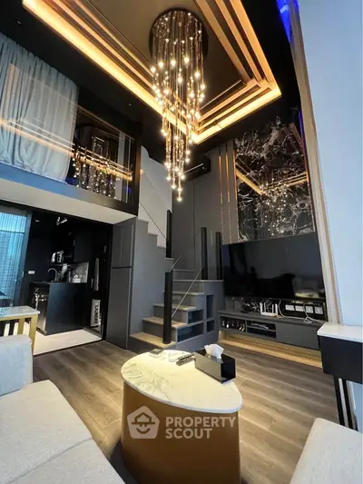 Luxurious modern living room with high ceiling and elegant chandelier