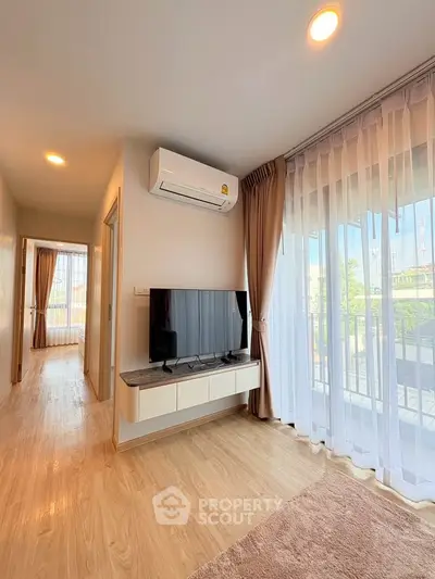 Bright living room with modern decor and large window view