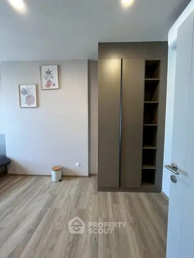 Modern interior with sleek wardrobe and stylish decor in a cozy living space.