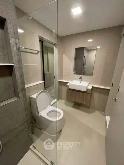 Modern bathroom with sleek design and glass shower enclosure