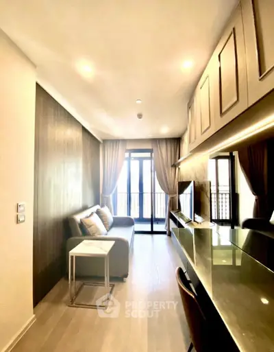 Modern living room with sleek design and balcony view, featuring stylish furniture and ambient lighting.