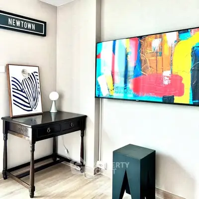 Modern living room with abstract art and sleek furniture