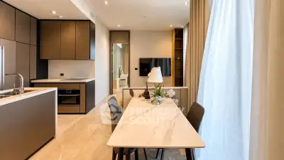 Modern open-plan kitchen and dining area with sleek design and natural light.