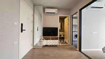 Modern apartment interior with sleek design, featuring air conditioning and in-unit laundry for convenience.