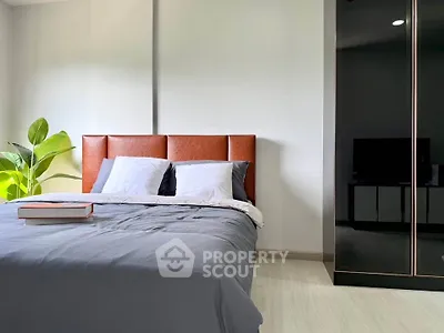 Modern bedroom with stylish bed and sleek wardrobe