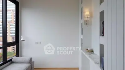 Modern minimalist living room with large window and built-in shelving