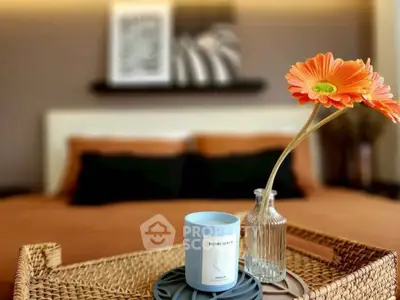 Cozy bedroom with stylish decor and vibrant flower arrangement