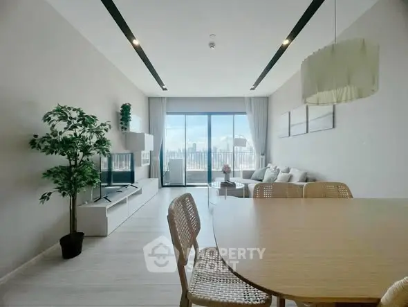 Spacious modern living room with city view and elegant decor