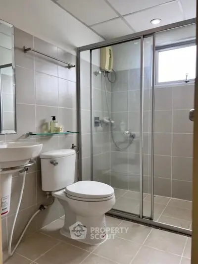 Modern bathroom with glass shower and sleek fixtures
