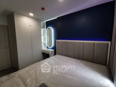 Modern bedroom with stylish lighting and sleek furniture design