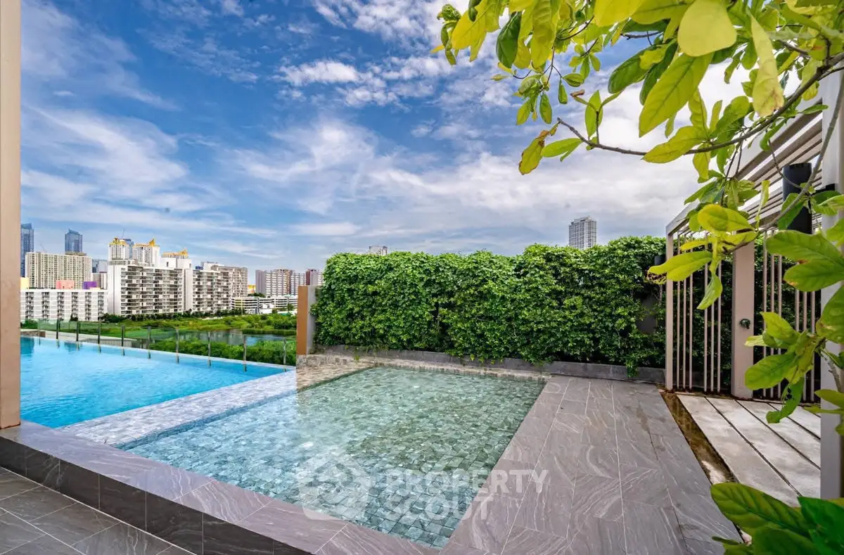 Luxurious rooftop pool with stunning city views and lush greenery
