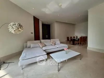 Spacious modern living room with elegant furniture and dining area