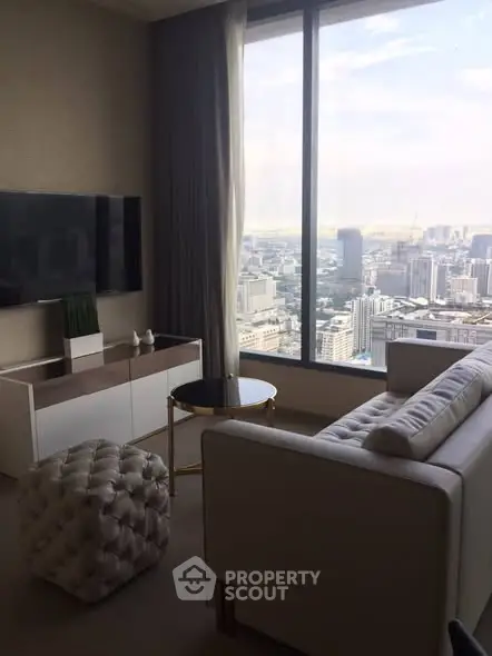 Luxurious living room with stunning city view from large window, elegant furniture, and modern decor.