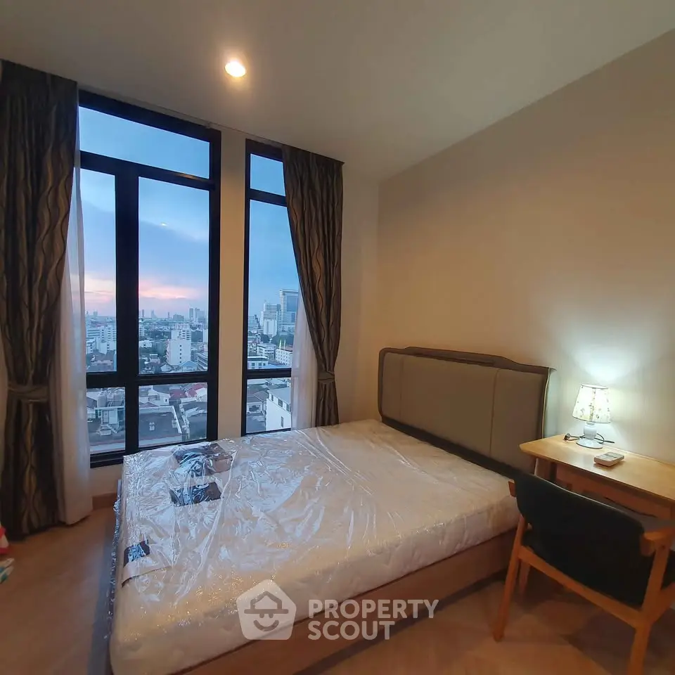 Modern bedroom with city view and stylish decor