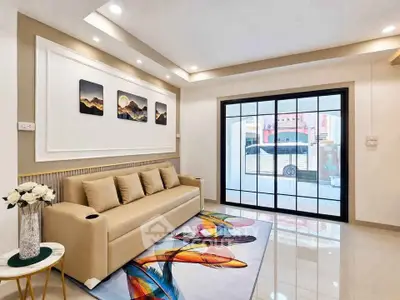 Modern living room with stylish decor and large window view