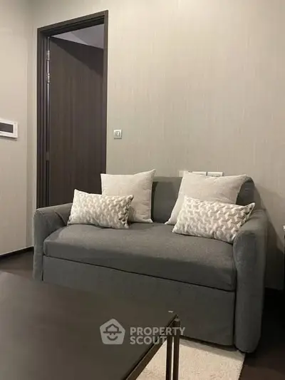 Cozy living room with stylish gray sofa and modern decor