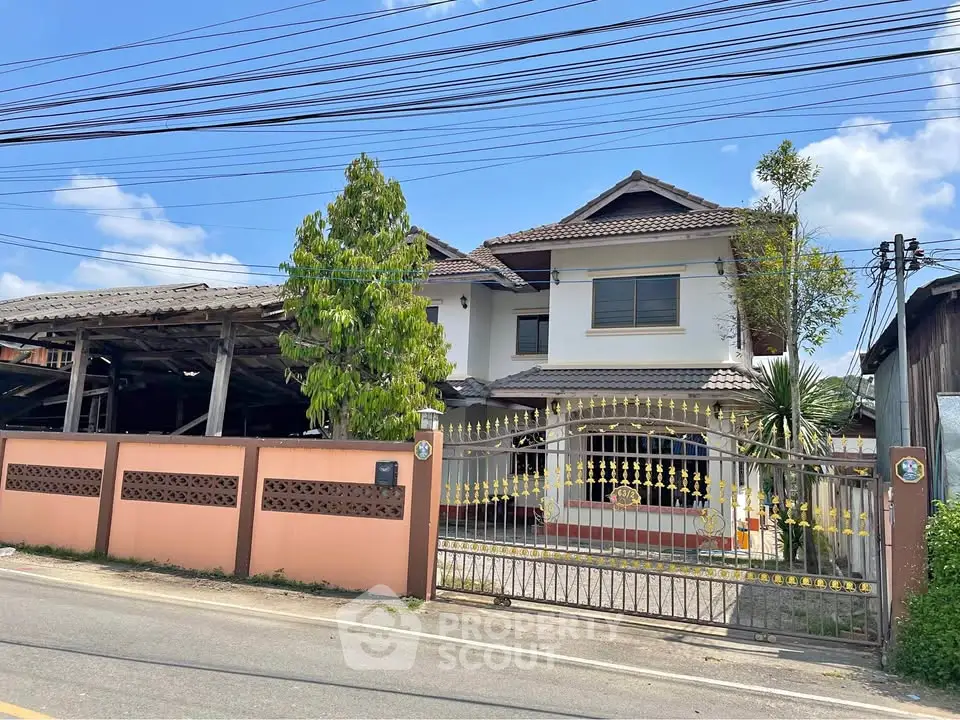 Charming two-story house with gated entrance and spacious driveway