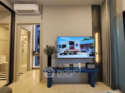 Modern living room with wall-mounted TV and stylish decor