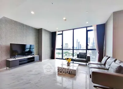 Luxurious modern living room with panoramic city views and elegant marble flooring.