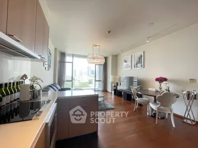 Spacious open-plan living room with modern kitchen and city view