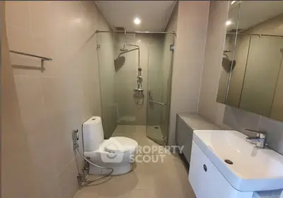 Modern bathroom with glass shower and sleek fixtures