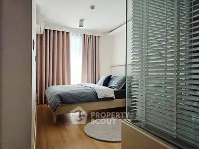 Modern bedroom with stylish decor and natural light
