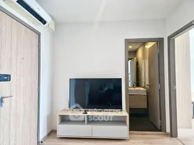 Modern living room with sleek TV setup and minimalist decor