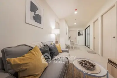 Modern living room with stylish decor and cozy seating in a contemporary apartment.