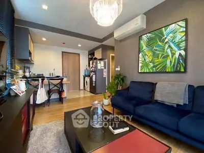 Modern living room with stylish decor and open kitchen layout