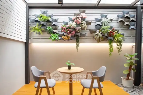 Charming patio with modern decor and vibrant wall planters