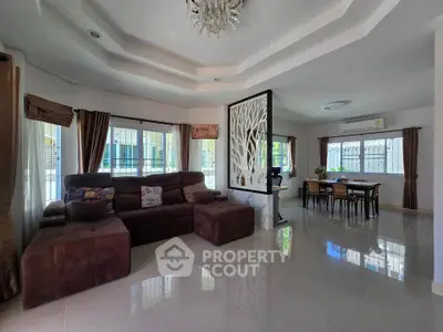 Spacious living room with elegant decor and dining area in modern home