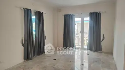 Spacious empty room with marble flooring and large windows with curtains