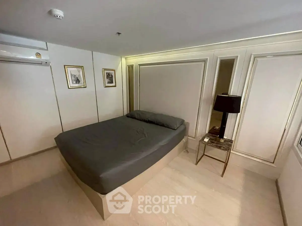 Modern bedroom with elegant decor and stylish lighting