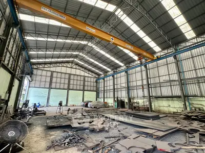 Spacious industrial warehouse with high ceilings and ample storage space.