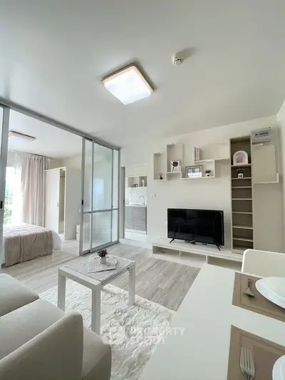 Modern open-plan living room with sleek design and natural light