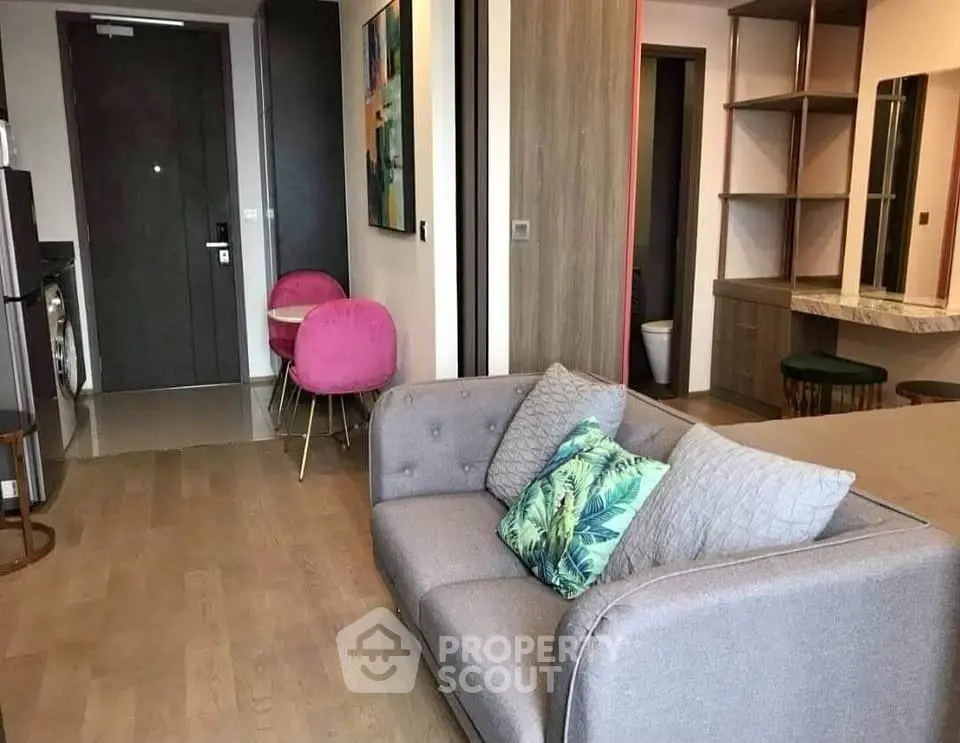 Modern living room with stylish sofa and vibrant decor in a cozy apartment