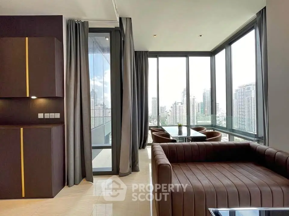 Luxurious corner unit living room with panoramic city views and modern furnishings.