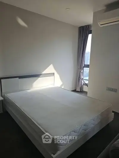 Modern minimalist bedroom with large window and air conditioning