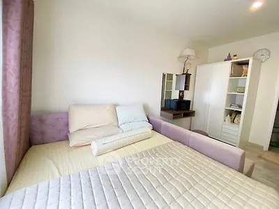 Cozy bedroom with modern decor and ample storage space