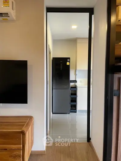 Modern apartment interior with sleek kitchen and stylish wooden furniture