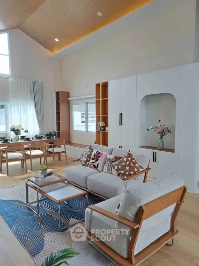 Spacious modern living room with stylish furniture and natural light