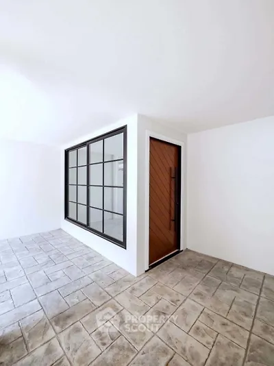 Modern minimalist entrance with sleek design and stylish flooring