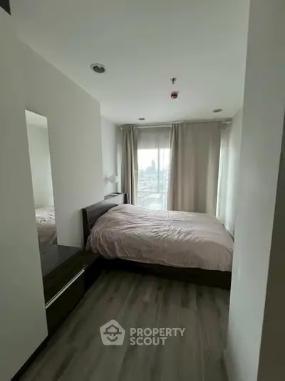 Cozy bedroom with city view and modern furnishings