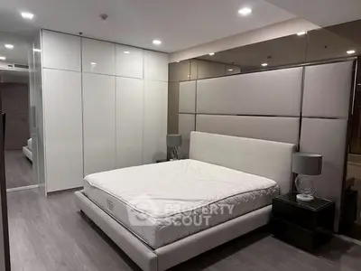 Modern bedroom with sleek design and spacious wardrobe