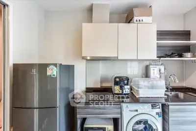 Modern kitchen with sleek appliances and ample storage space